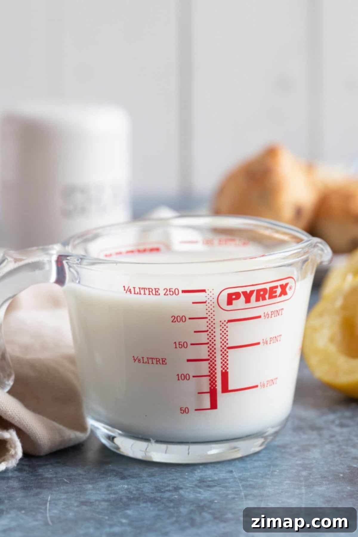 Homemade buttermilk in a glass jug.