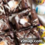 Εύκολα Μπράουνις με Αυγά Κρέμας Κάντμπερι 9 Creme egg brownies κομμένα σε τετράγωνα.