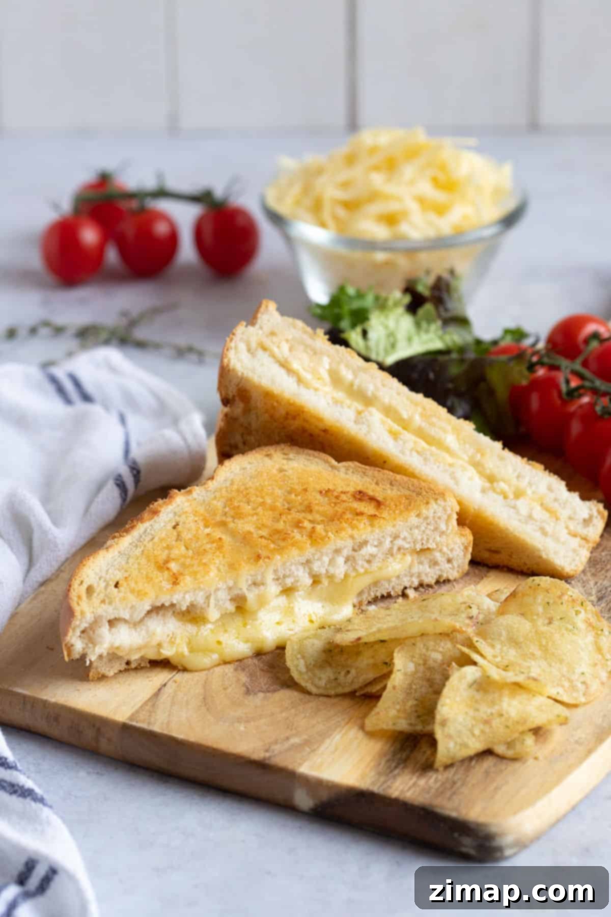 Air fryer cheese toastie with tomatoes and crisps.