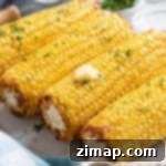 Εύκολο Καλαμπόκι στη Φριτέζα Αέρος 7 Καλαμπόκι σε φριτέζα αέρος με λιωμένο βούτυρο στην κορυφή.