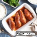 Εύκολη Συνταγή Κοτόπουλου Coca-Cola Light για Αργή Κουζίνα 8 Κοτόπουλο Diet Coke σε λευκή πιατέλα σερβιρίσματος.