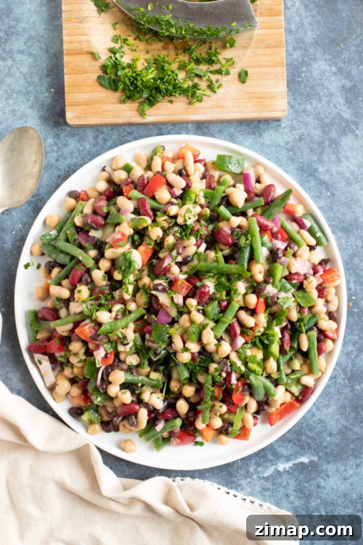 5 bean salad garnished with parsley.