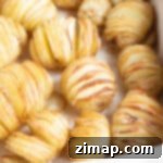 Πανεύκολη συνταγή για μίνι πατάτες Hasselback 7 Μίνι πατάτες Hasselback σε ταψί.