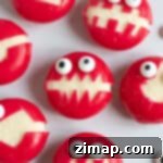 Εύκολα Αποκριάτικα Τερατάκια Babybel 7 Babybel cheese monsters on a plate.