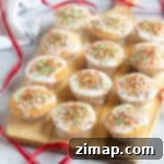 Εύκολα Χριστουγεννιάτικα Καπκέικ με Τρούφα 8 Κεκάκια νεράιδων με γιορτινά στολίδια.