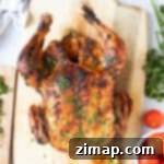 Ψητό Κοτόπουλο με Χαρίσα 10 Κοτόπουλο χαρίσα στο φούρνο σε ξύλινη σανίδα κοπής.