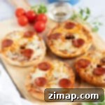 Γρήγορα κι Εύκολα Μπέιγκελ Πίτσας στον Αέρα 9 Pizza bagels σε φριτέζα αέρος με φέτες chorizo και λιωμένο τυρί.