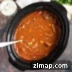 Σιγομαγειρεμένο Μοσχαρίσιο Γκούλας 5 Μοσχαρίσιο γκούλας αργού κύκλου μαγειρέματος σε μαύρο σκεύος αργού κύκλου.