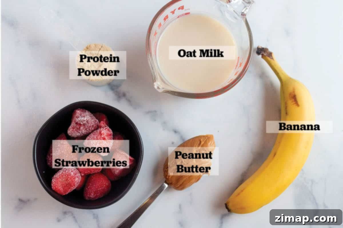 Πώς να φτιάξεις smoothie μπανάνας χωρίς γιαούρτι 3 Ένα ποτήρι γάλα βρώμης, μπανάνα, φυστικοβούτυρο, σκόνη πρωτεΐνης και κατεψυγμένες φράουλες.