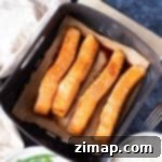 Σολομός στο Air Fryer με Γλάσο Μελιού 7 Φιλέτα σολομού σε καλάθι φριτέζας αέρος.