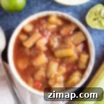 Γρήγορη Κομπόστα Ραβέντι με Τζίντζερ 6 Stewed rhubarb in an orange bowl.