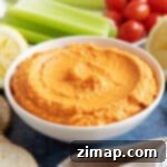 Χούμους με Ψητή Κόκκινη Πιπεριά 6 Χούμους κόκκινης πιπεριάς με στικς σέλινου.