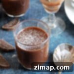 Εύκολα Σοκολατένια Γλυκάκια με Πορτοκάλι 6 Pots σοκολάτας πορτοκάλι πασπαλισμένα με ζάχαρη άχνη.
