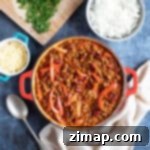 Γρήγορο Κουόρν Τσίλι 7 Quorn τσίλι κον κάρνε με ρύζι και τριμμένο τυρί.